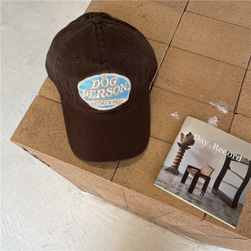 Dog person embroidered hat in brown
Size: Adjustable