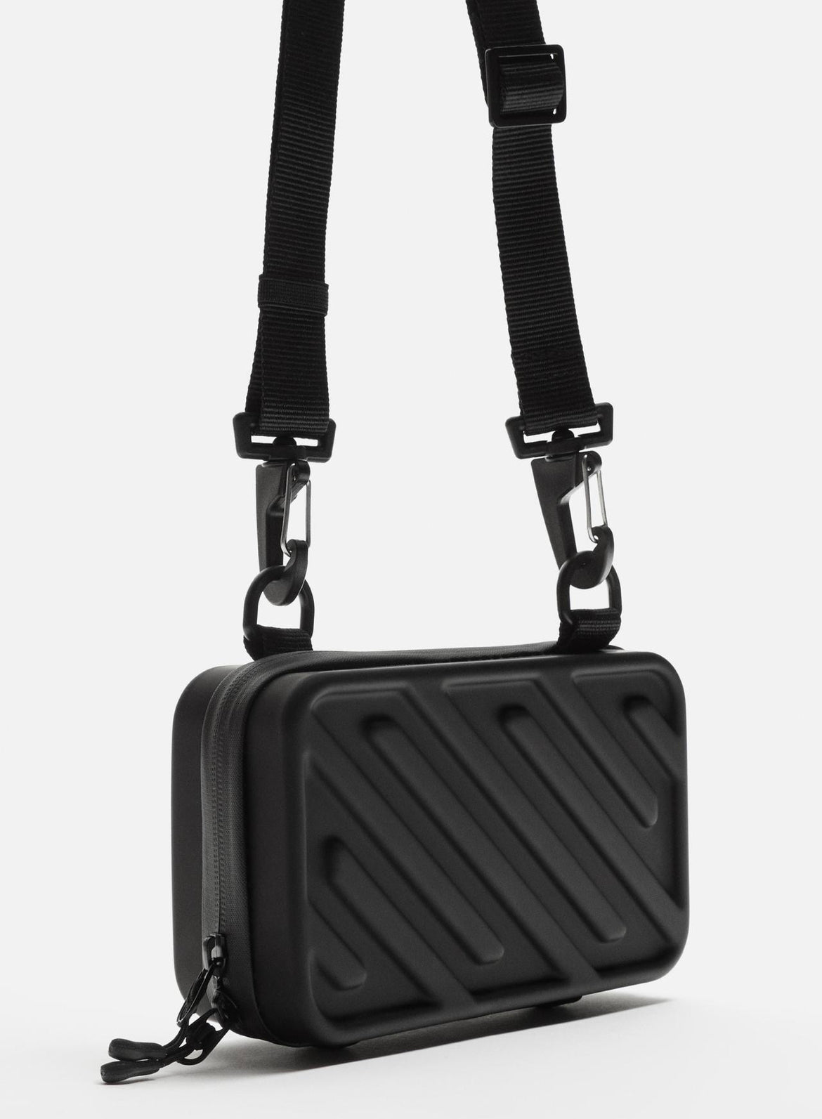 Rigid embossed crossbody bag