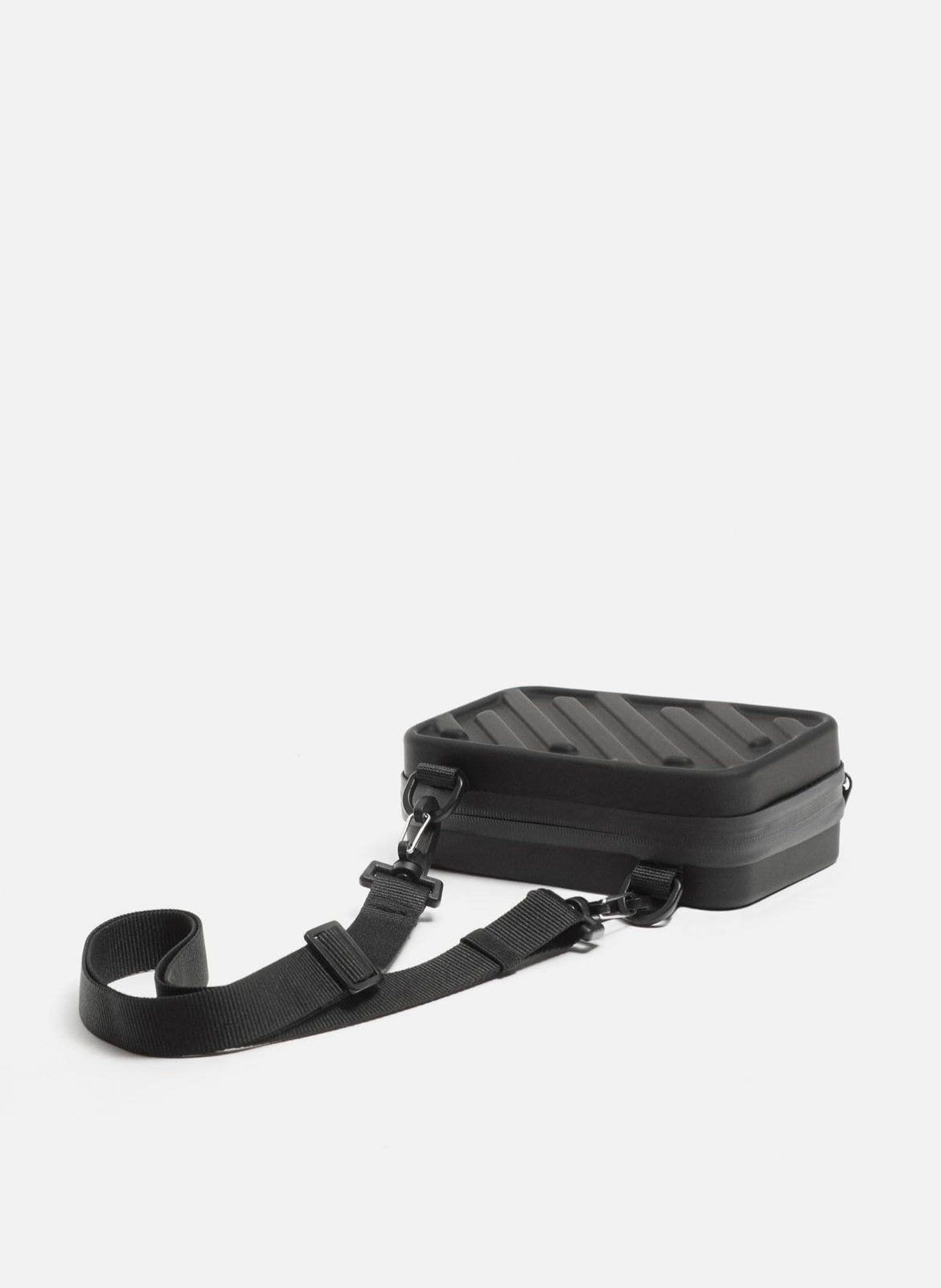 Rigid embossed crossbody bag