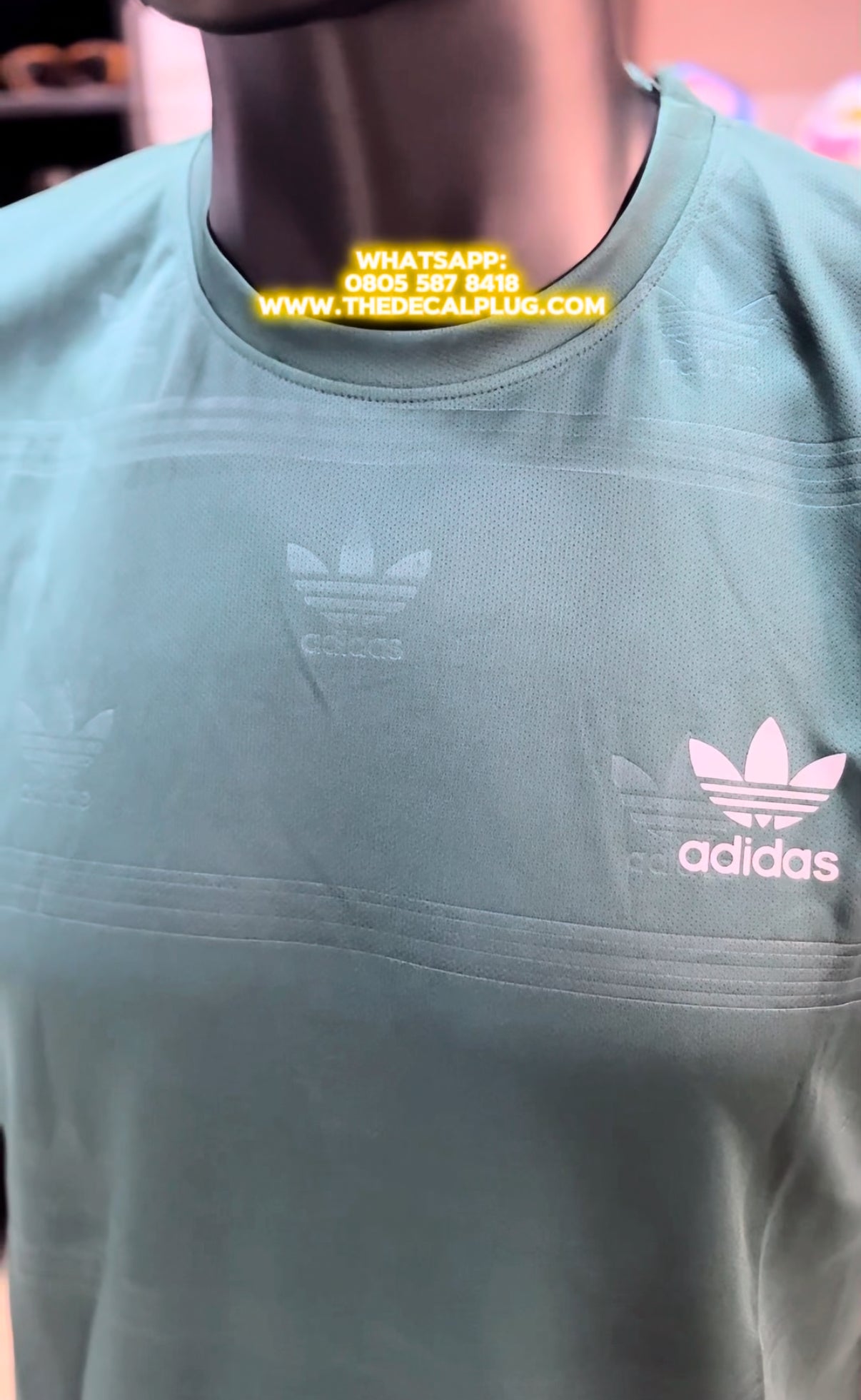 Adidas embossed logo sport top In green