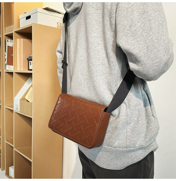 Embossed pattern side bag
