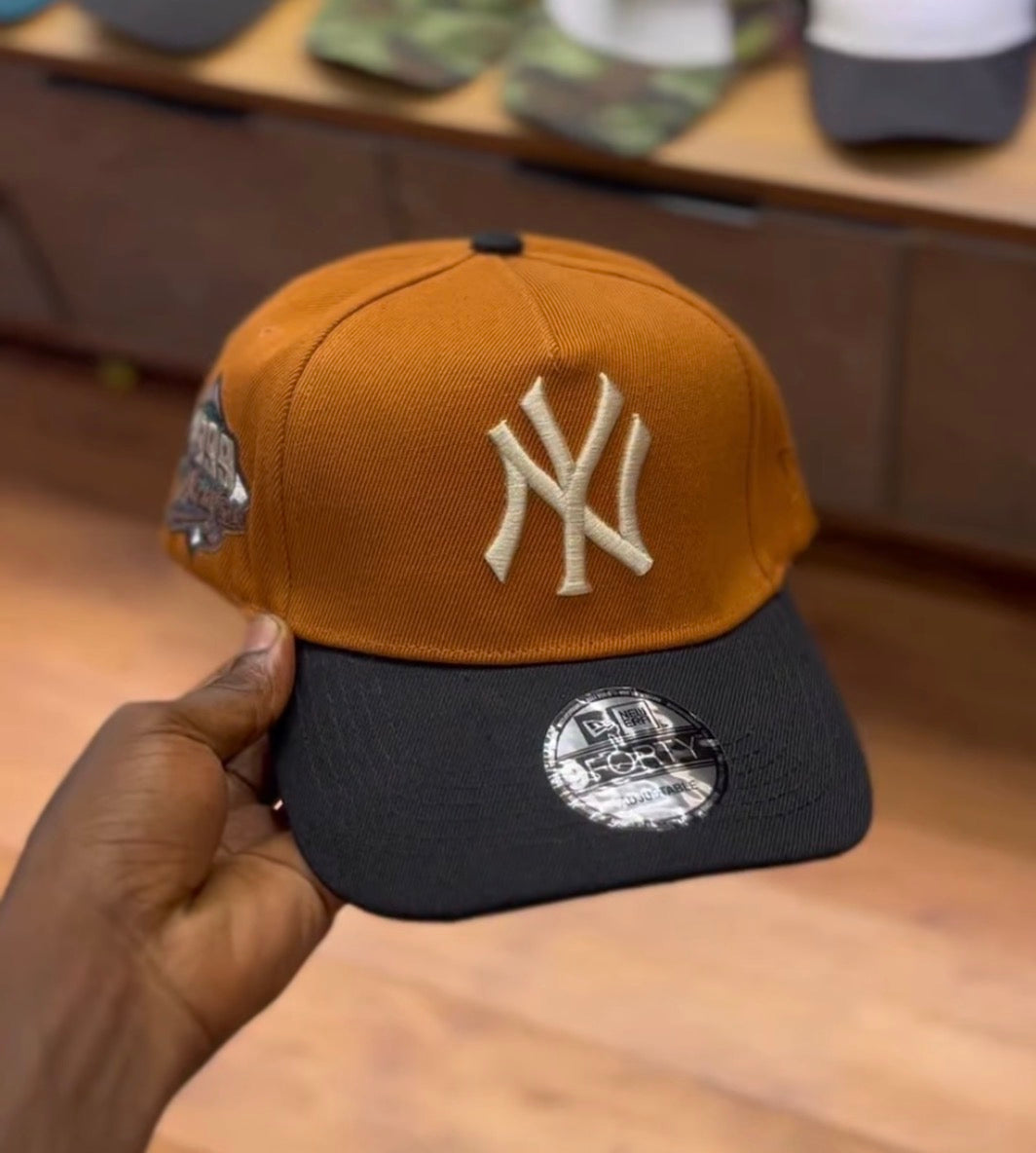 NY colorblock snapback cap
Burnt orange/black